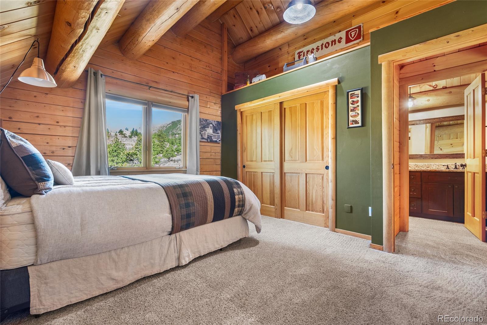 685 Jesse Lane Bailey, CO 80421 - Photo 28 of 50 a bed sitting in front of a brick building