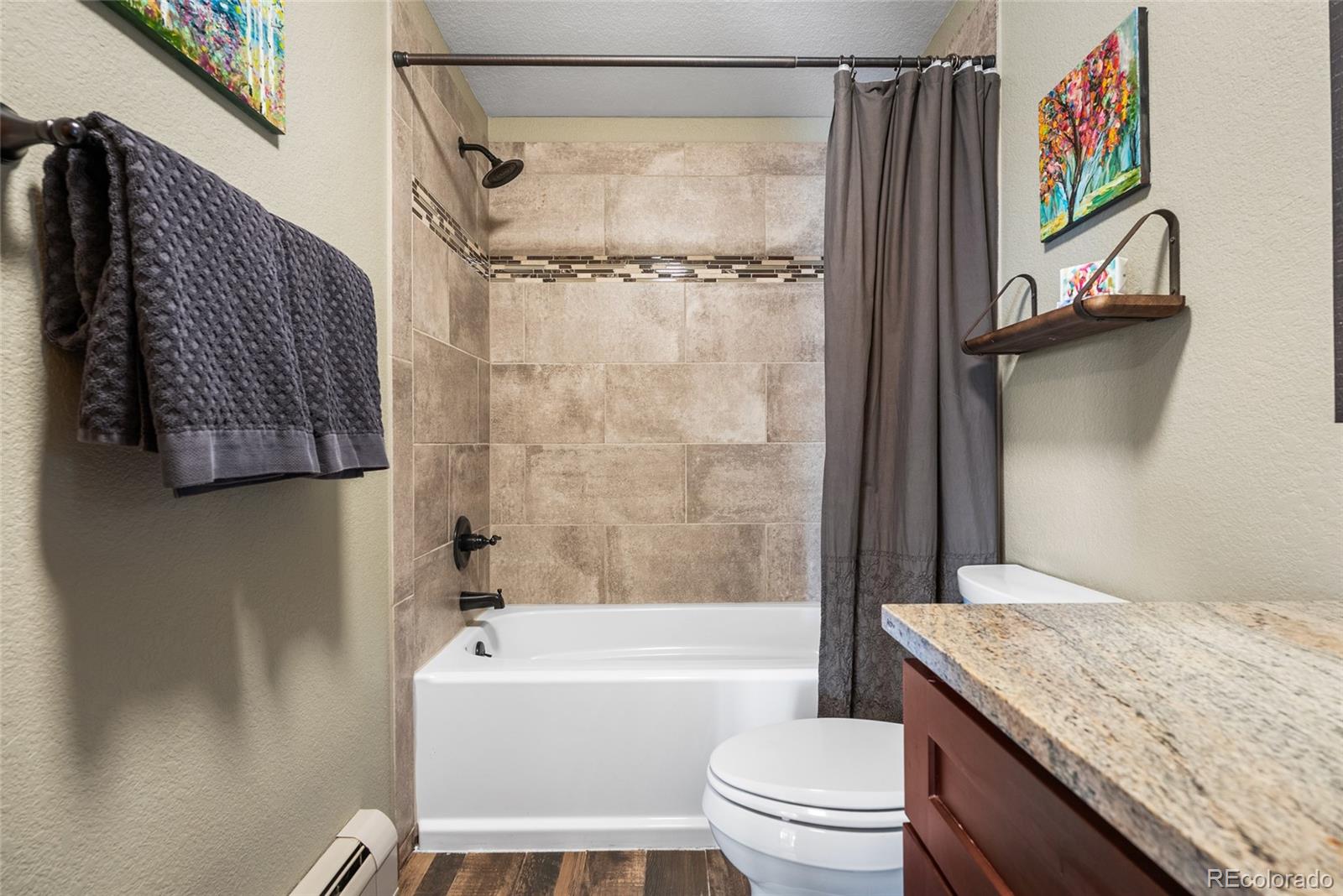 685 Jesse Lane Bailey, CO 80421 - Photo 35 of 50 a bathroom with a granite countertop bathtub shower sink vanity and toilet