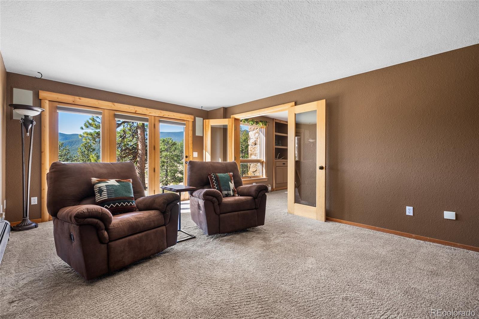 685 Jesse Lane Bailey, CO 80421 - Photo 36 of 50 a living room with furniture and large windows