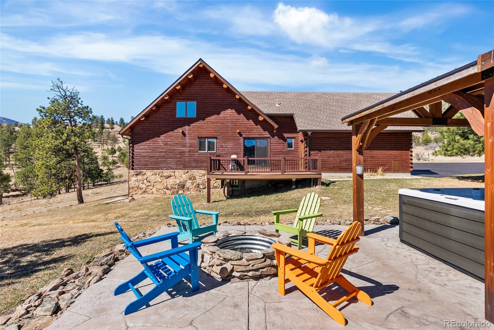 685 Jesse Lane Bailey, CO 80421 - Photo 41 of 50 a view of a terrace with chairs and wooden fence