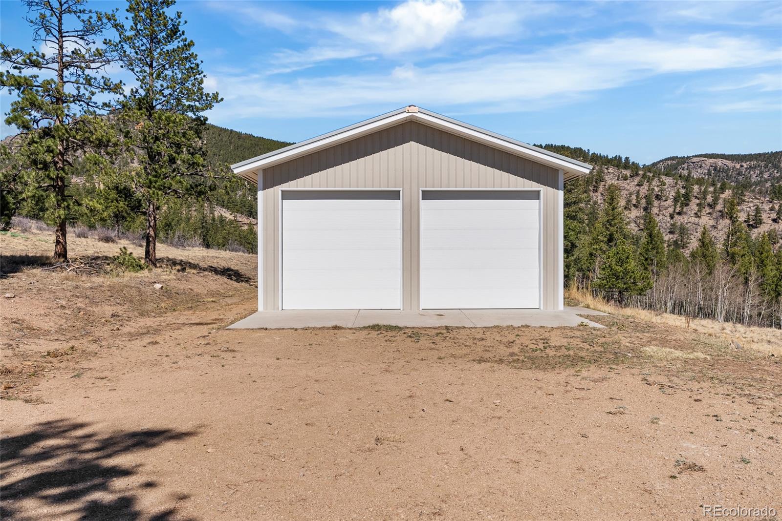 685 Jesse Lane Bailey, CO 80421 - Photo 46 of 50 a front view of a house with a yard