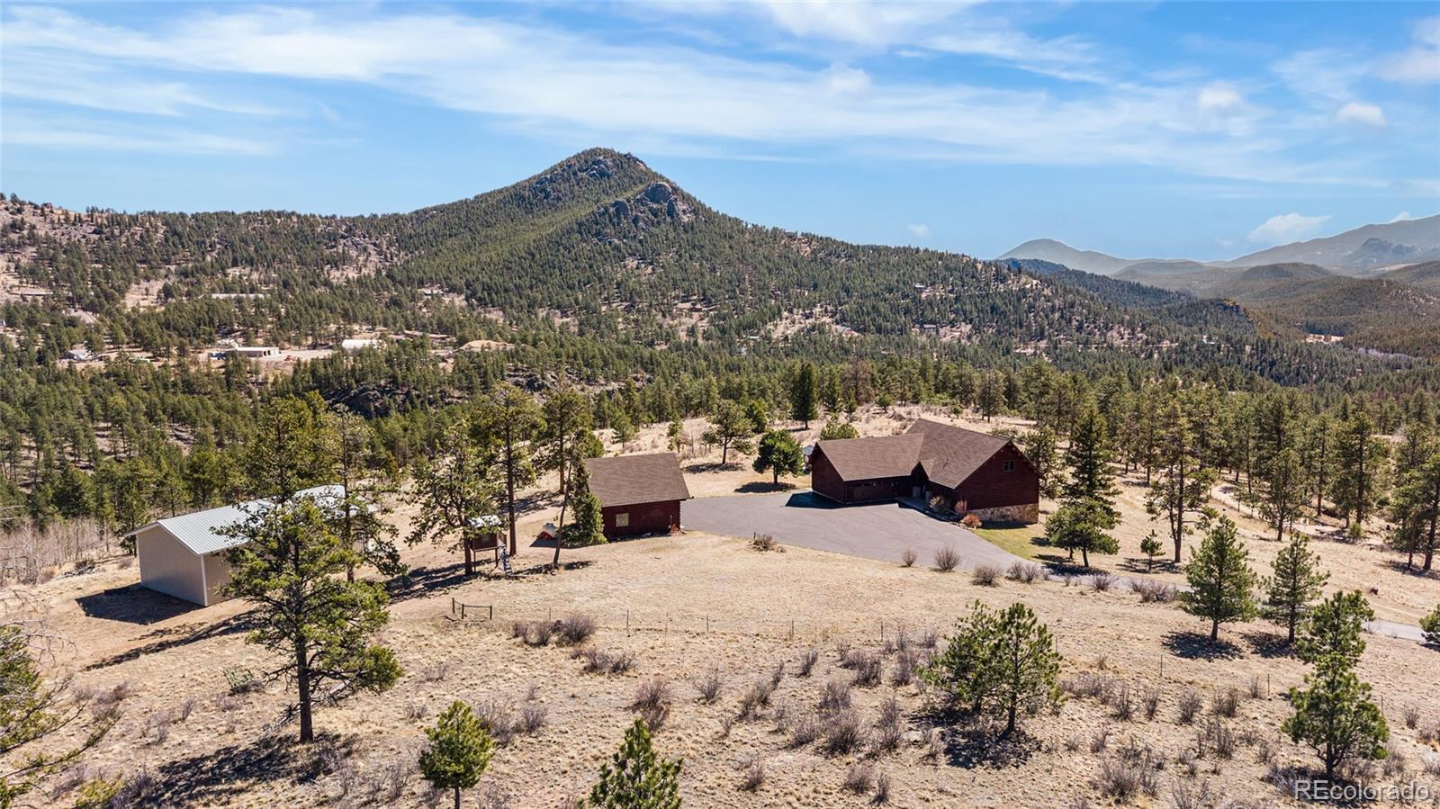 685 Jesse Lane Bailey, CO 80421 - Photo 49 of 50 a view of a terrace with a bench