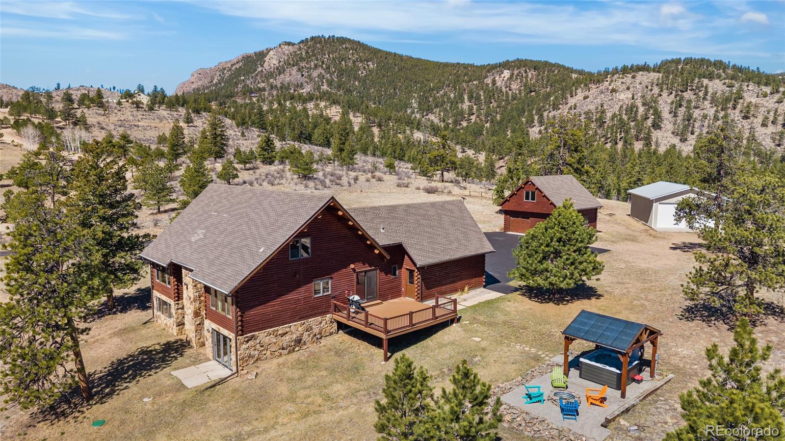 685 Jesse Lane Bailey, CO 80421 - Photo 50 of 50 an aerial view of a house with a yard and mountain view in back