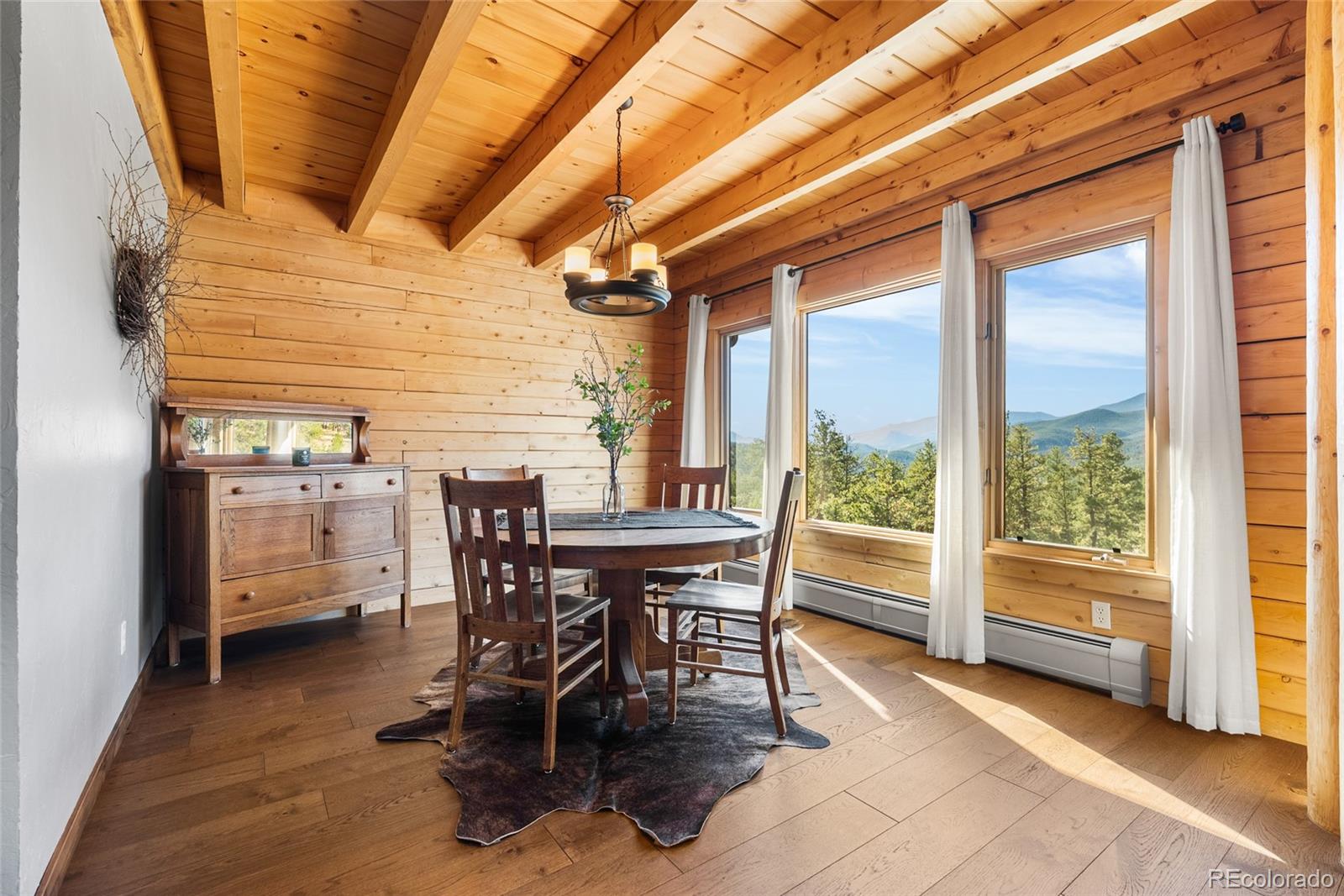 685 Jesse Lane Bailey, CO 80421 - Photo 6 of 50 a dining room with furniture and large windows