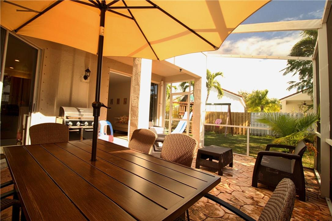 790 Chimney Rock Road Weston, FL 33327 - Photo 16 of 18 a outdoor living space with patio furniture