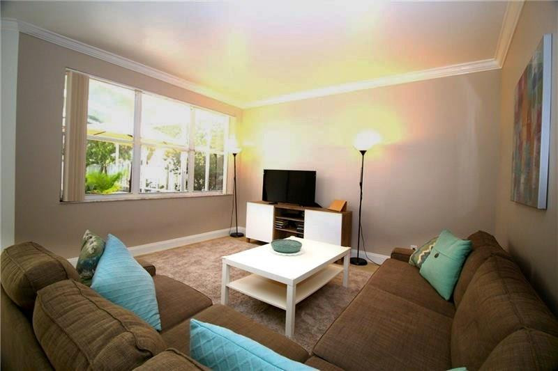 790 Chimney Rock Road Weston, FL 33327 - Photo 3 of 18 a living room with furniture and a flat screen tv