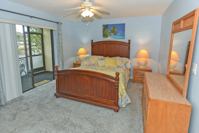 a bedroom with a bed and a mirror