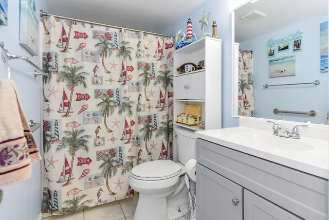 a bathroom with a sink and a white toilet