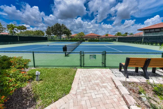 a view of a garden with sitting area