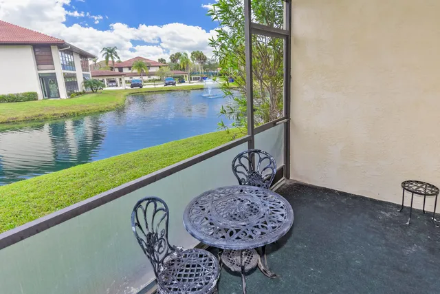 a view of a water fountain with a lake view