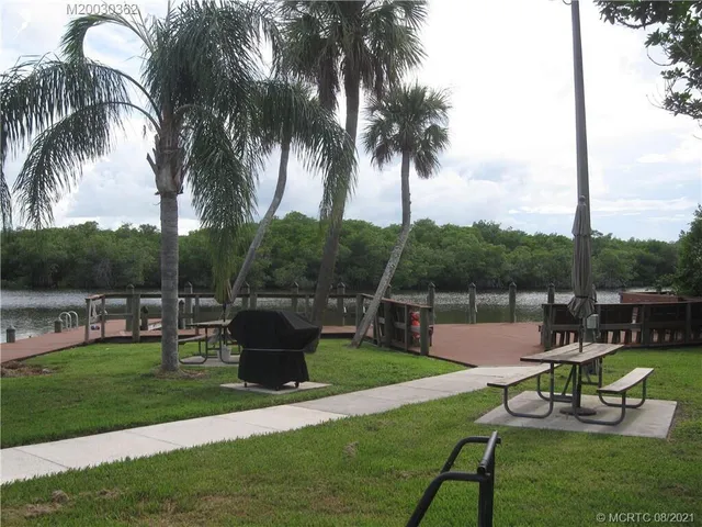 a view of a patio with couches and a fire pit