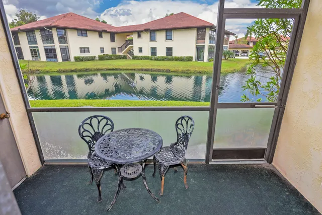a dining room with a table and chairs