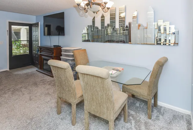 a view of a dining room with furniture window and outside view