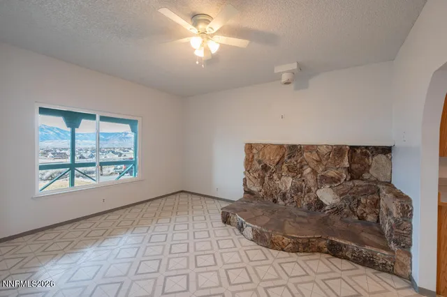 a kitchen with stainless steel appliances granite countertop a refrigerator a sink dishwasher and granite countertops with cabinets