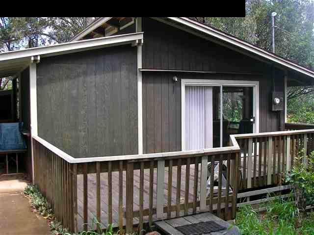 22 West Kuiaha Road Haiku, HI 96708 - Photo 2 of 23 a view of a balcony with wooden floor and fence