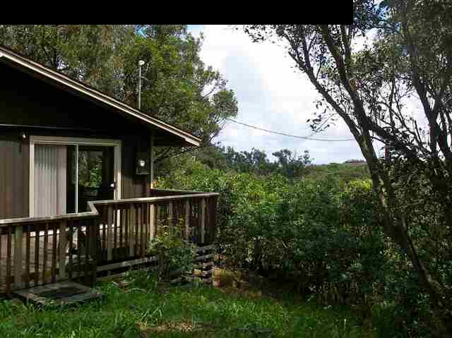 22 West Kuiaha Road Haiku, HI 96708 - Photo 3 of 23 a view of house with backyard space and garden