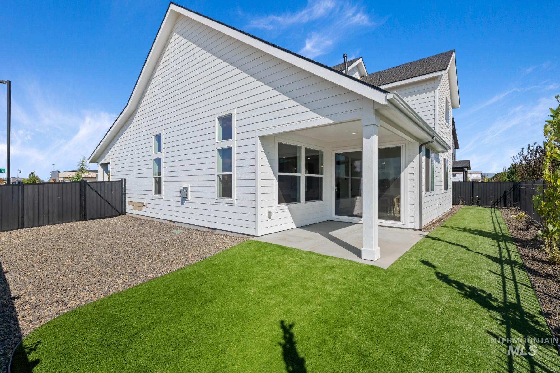 945 West Malbar Street Meridian, ID 83646 - Photo 38 of 42 Back of house featuring a fenced backyard and a patio