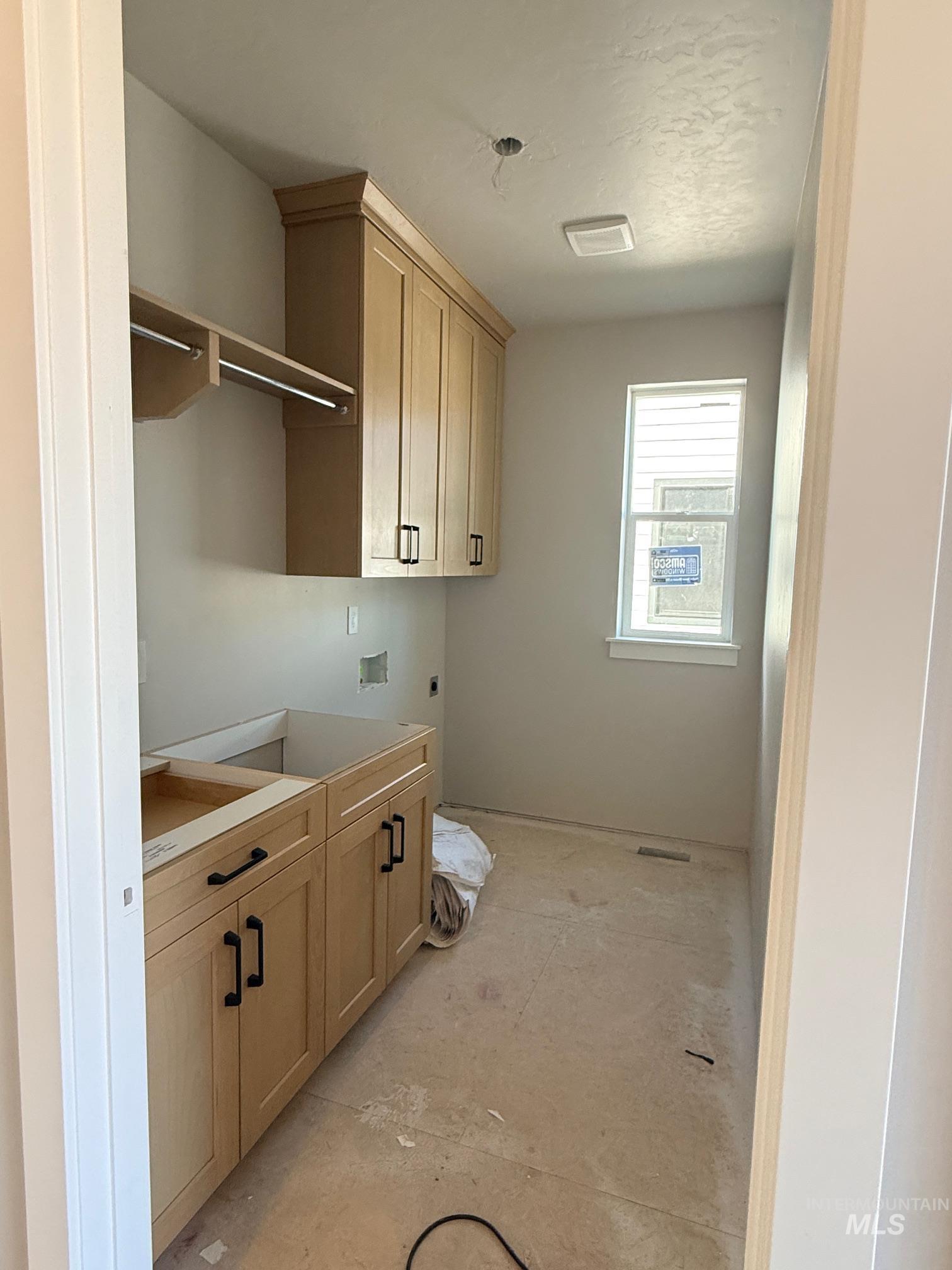945 West Malbar Street Meridian, ID 83646 - Photo 5 of 37 Laundry area featuring cabinet space, washer hookup, and hookup for an electric dryer