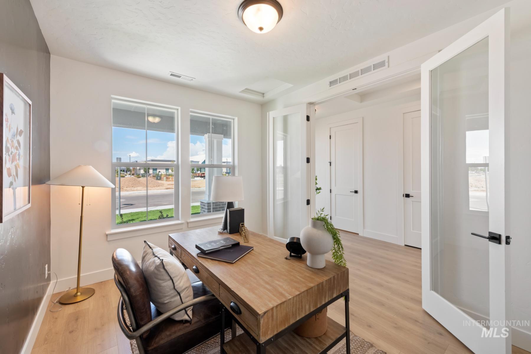 945 West Malbar Street Meridian, ID 83646 - Photo 9 of 42 Home office featuring plenty of natural light and light wood-type flooring