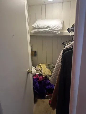 a bathroom with a granite countertop sink and cabinets