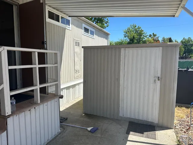 a view of balcony with furniture