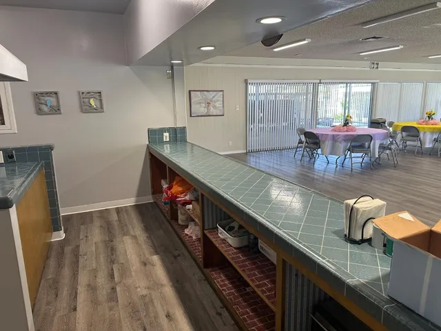 a living room with furniture and a book shelf
