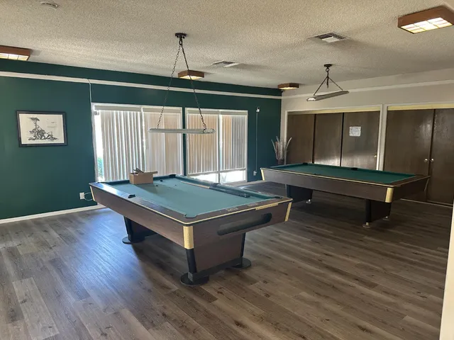 a swimming pool with outdoor seating outdoor seating and barbeque oven