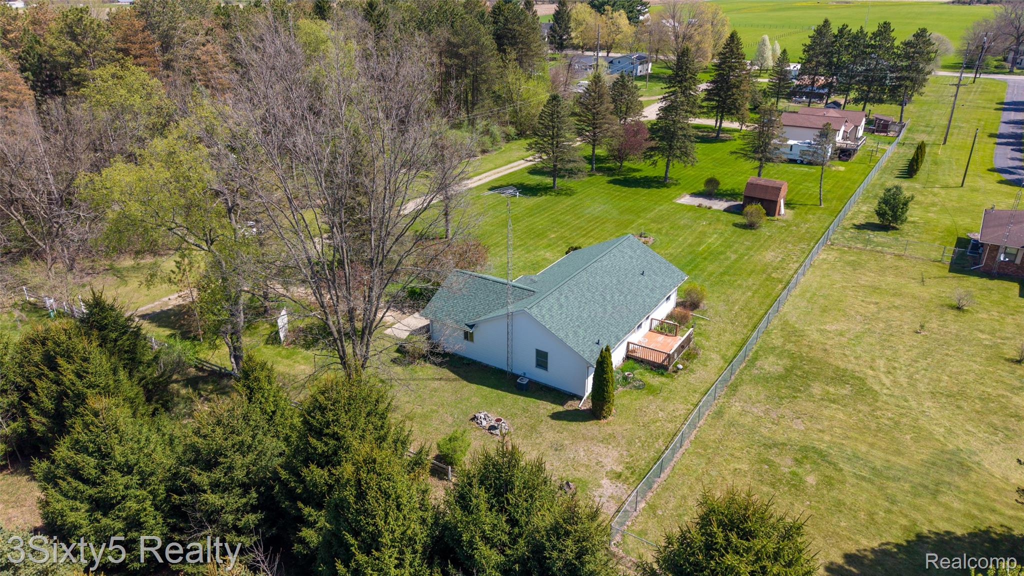 1783 Farnsworth Road Lapeer, MI 48446 - Photo 44 of 51 View of subject property featuring a tree filled landscape