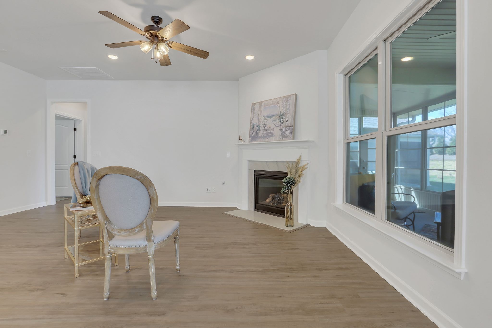 1084 Sumner Grove Spring Hill, TN 37174 - Photo 11 of 40 a view of a livingroom with furniture a fireplace a rug and a large window