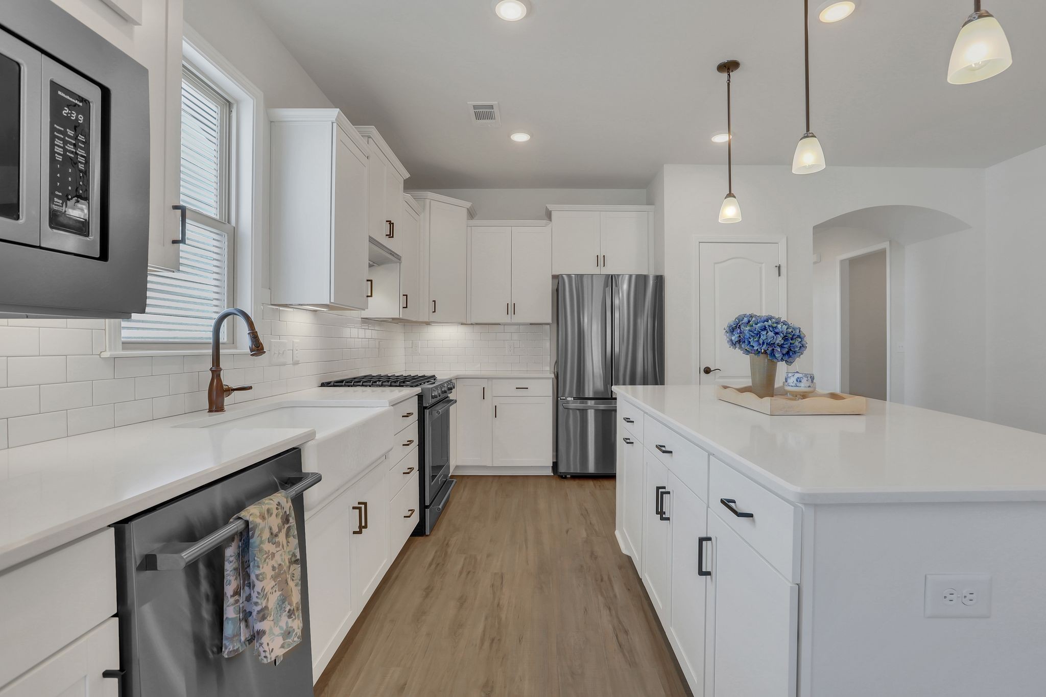 1084 Sumner Grove Spring Hill, TN 37174 - Photo 15 of 40 a kitchen with stainless steel appliances a sink stove and refrigerator
