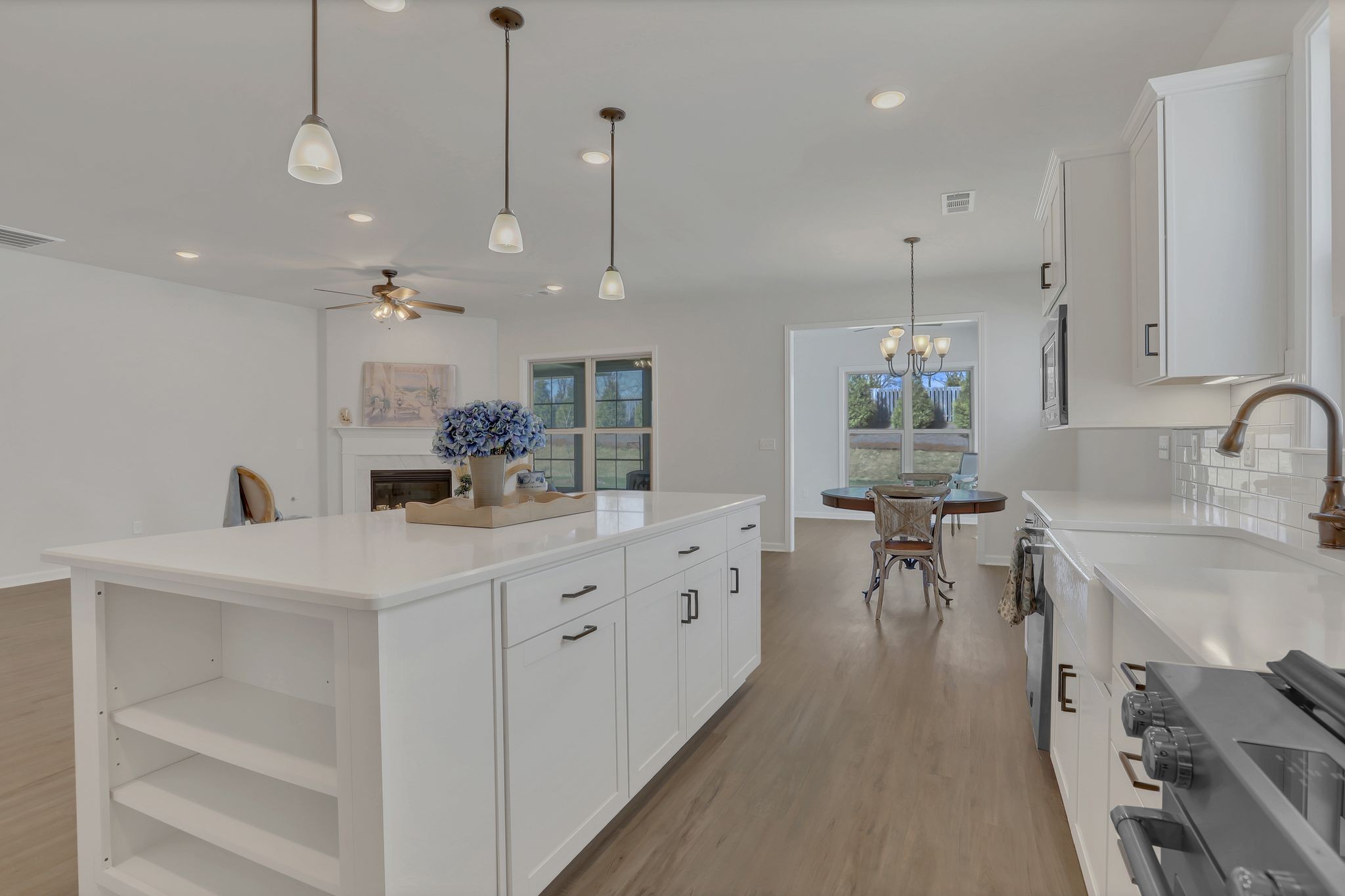 1084 Sumner Grove Spring Hill, TN 37174 - Photo 16 of 40 a kitchen with sink stove and cabinets