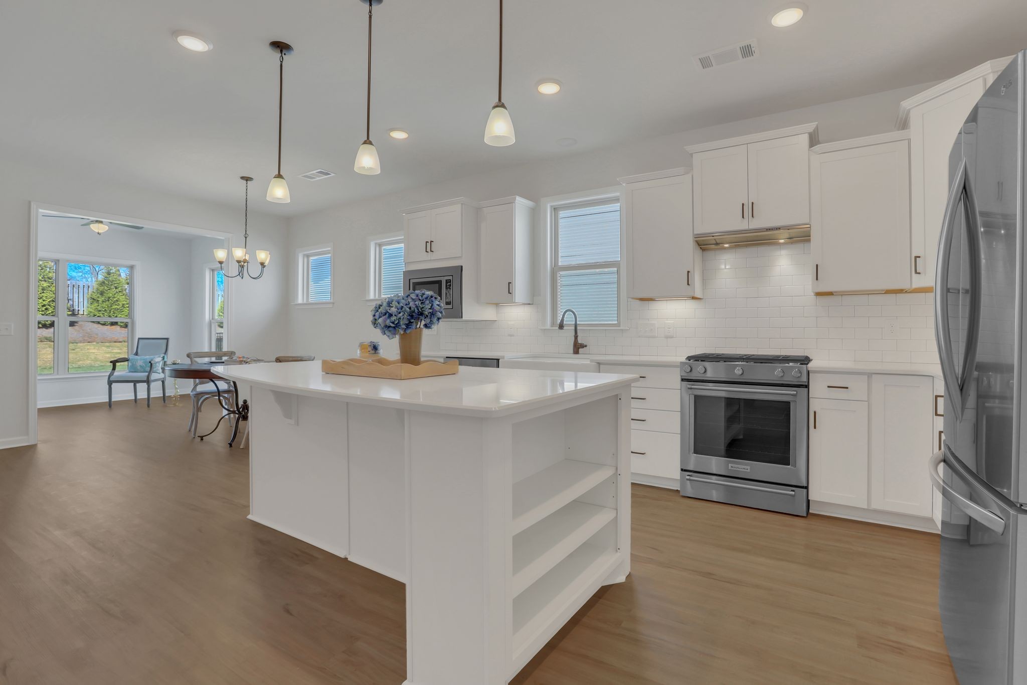 1084 Sumner Grove Spring Hill, TN 37174 - Photo 17 of 40 a kitchen with a sink stainless steel appliances and cabinets