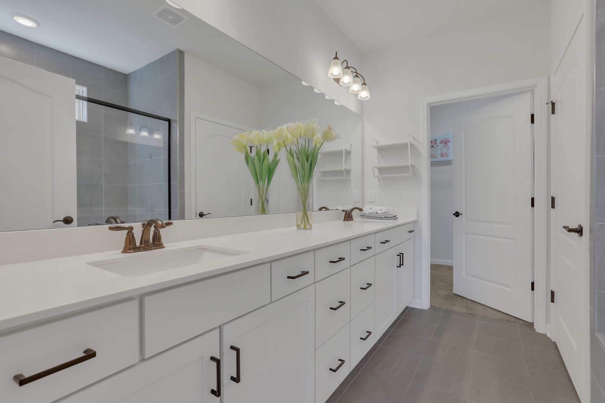 1084 Sumner Grove Spring Hill, TN 37174 - Photo 20 of 40 a bathroom with double vanity sink and a mirror