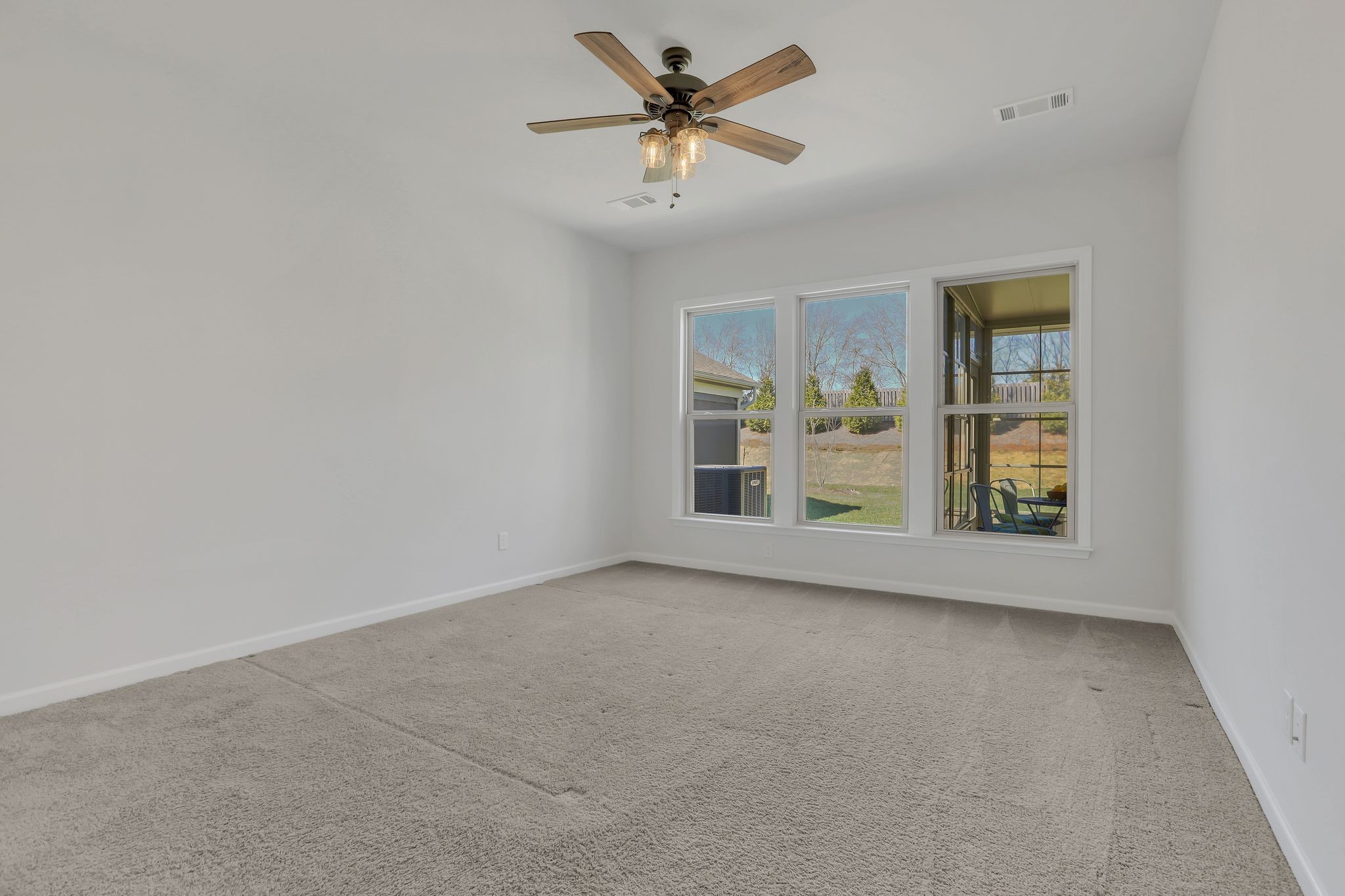 1084 Sumner Grove Spring Hill, TN 37174 - Photo 27 of 40 an empty room with windows and fan