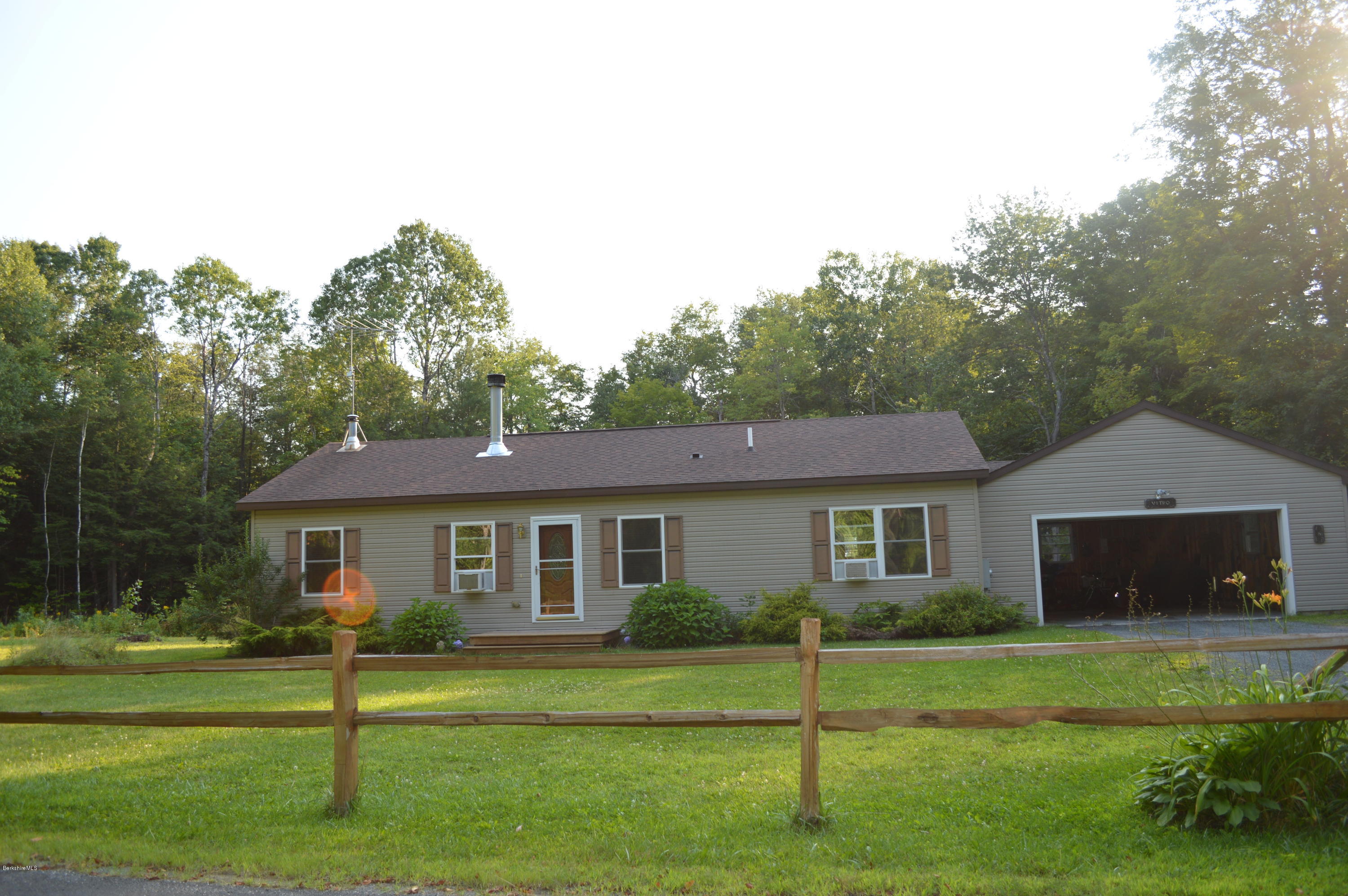 753 Upper Valley Road Washington, MA 01223 - Photo 1 of 32 a front view of a house with a yard and trees