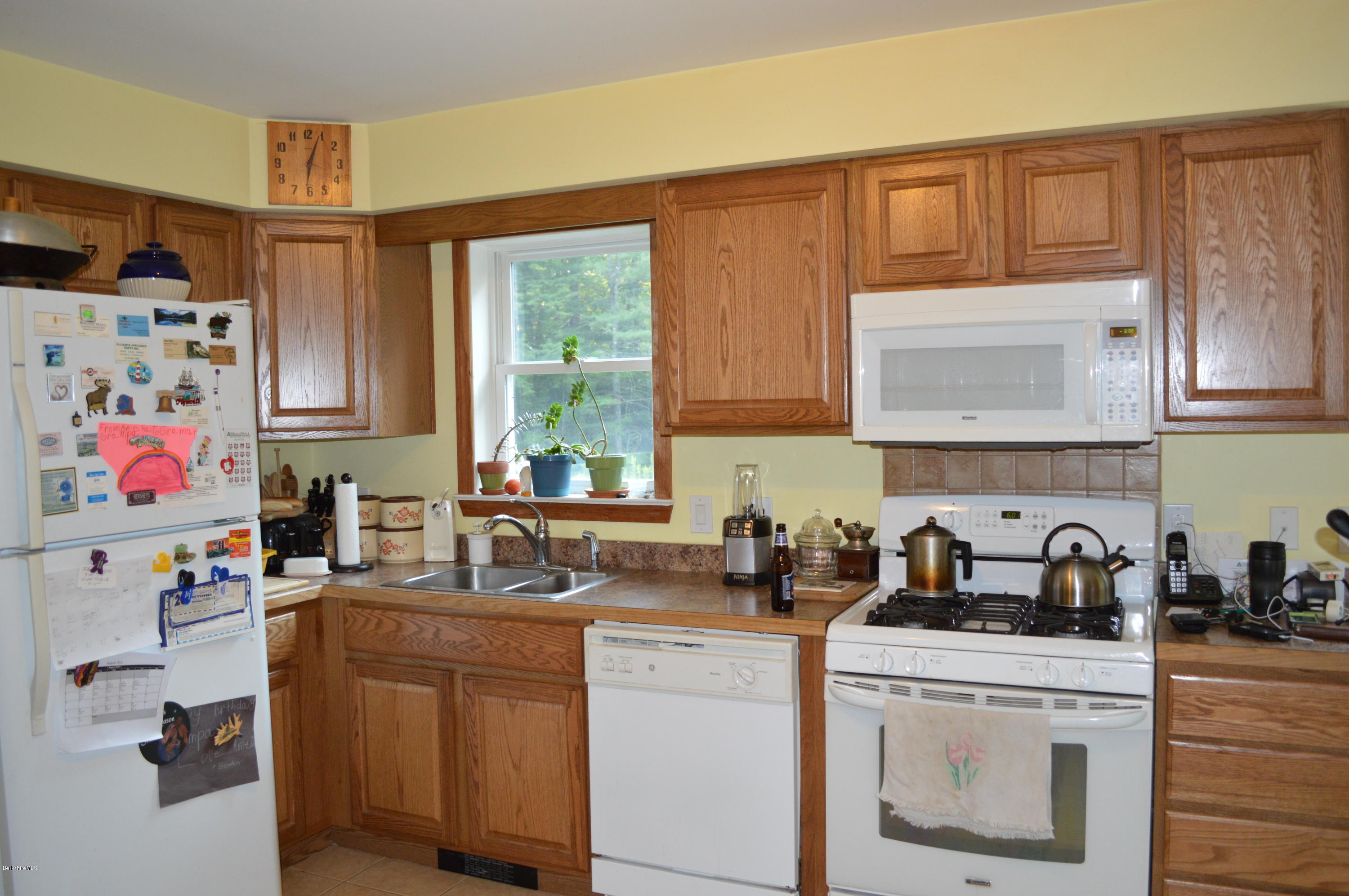753 Upper Valley Road Washington, MA 01223 - Photo 14 of 32 a kitchen with sink cabinets and window