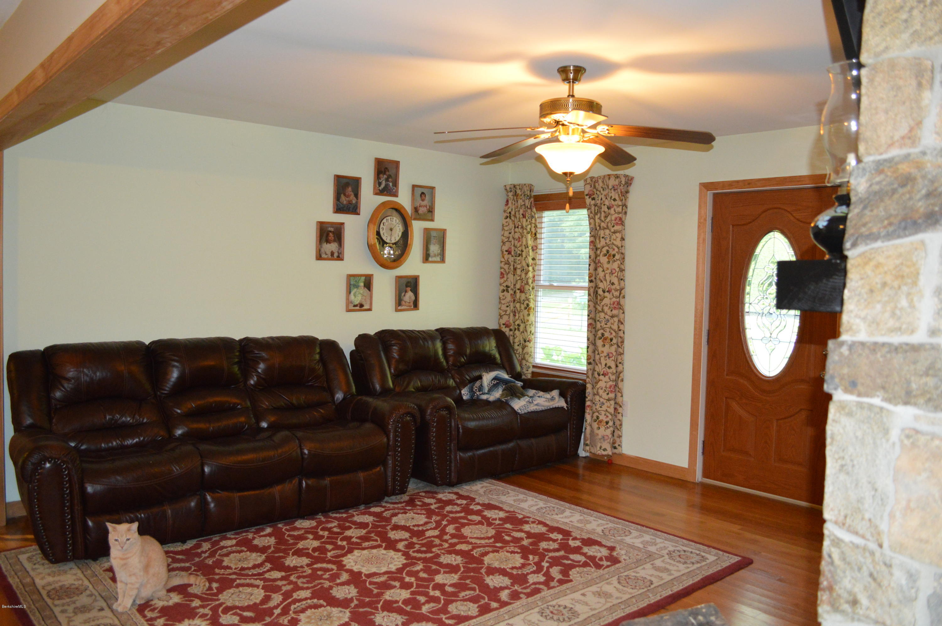 753 Upper Valley Road Washington, MA 01223 - Photo 20 of 32 a living room with couch and a mirror