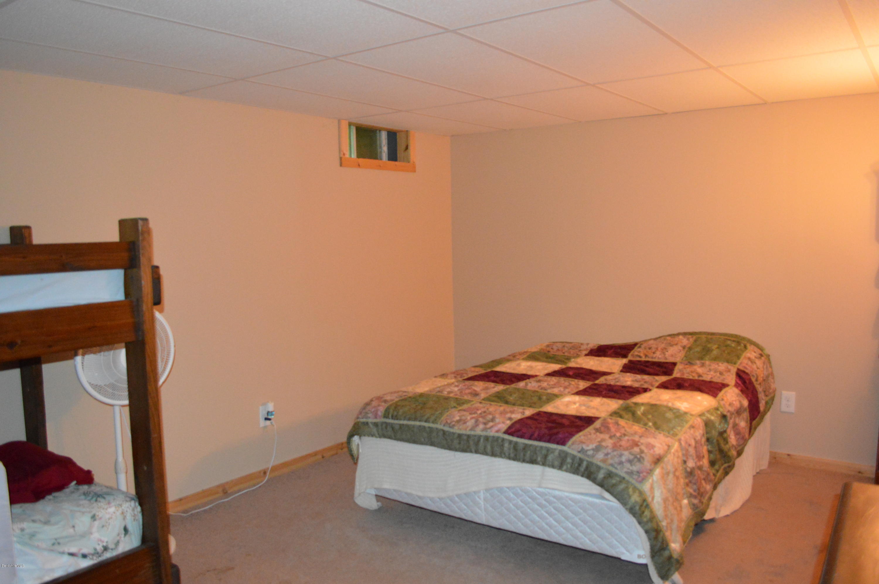 753 Upper Valley Road Washington, MA 01223 - Photo 21 of 32 a bedroom with a bed and a window