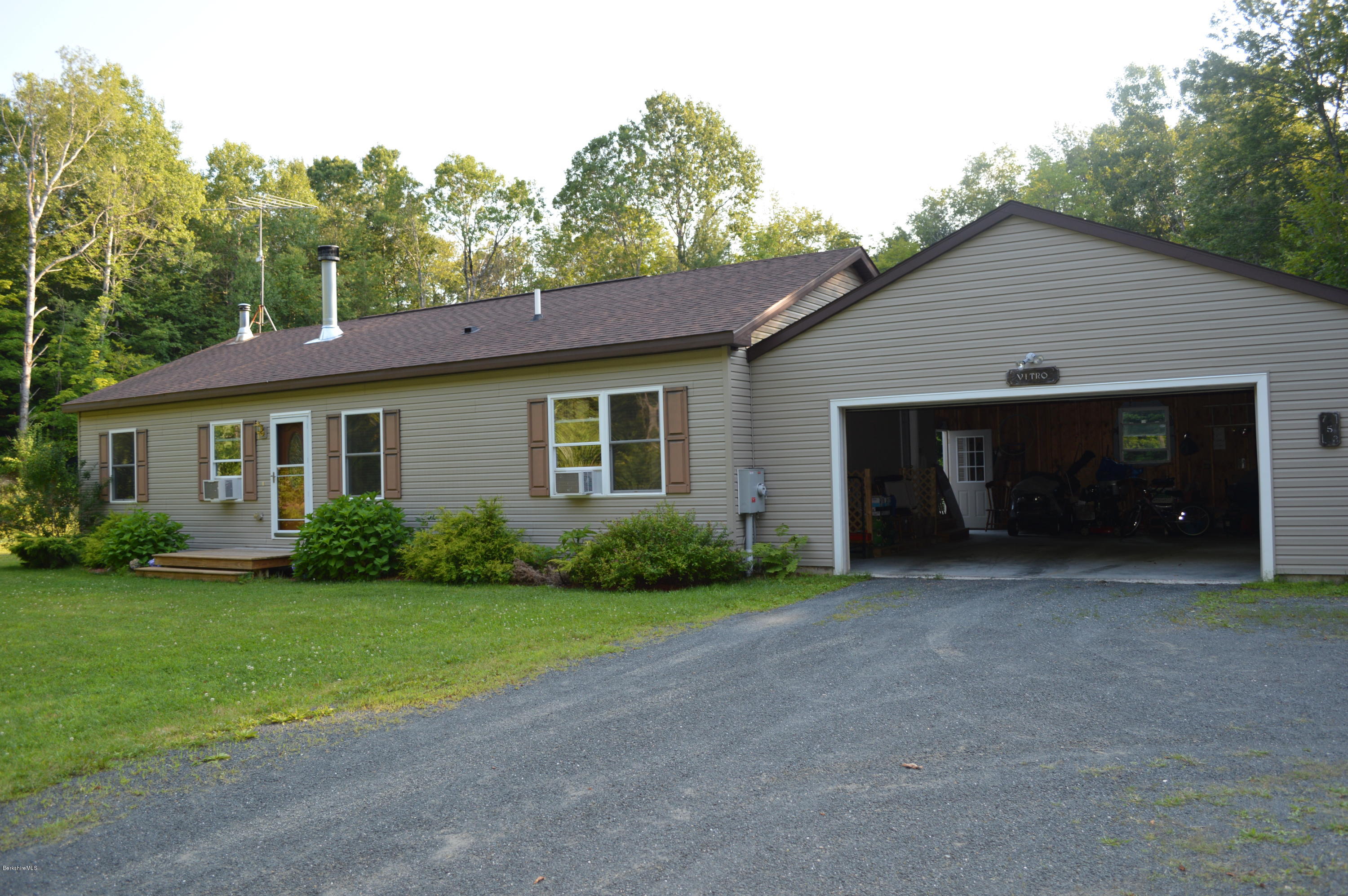 753 Upper Valley Road Washington, MA 01223 - Photo 23 of 32 a view of a house with a yard and garage