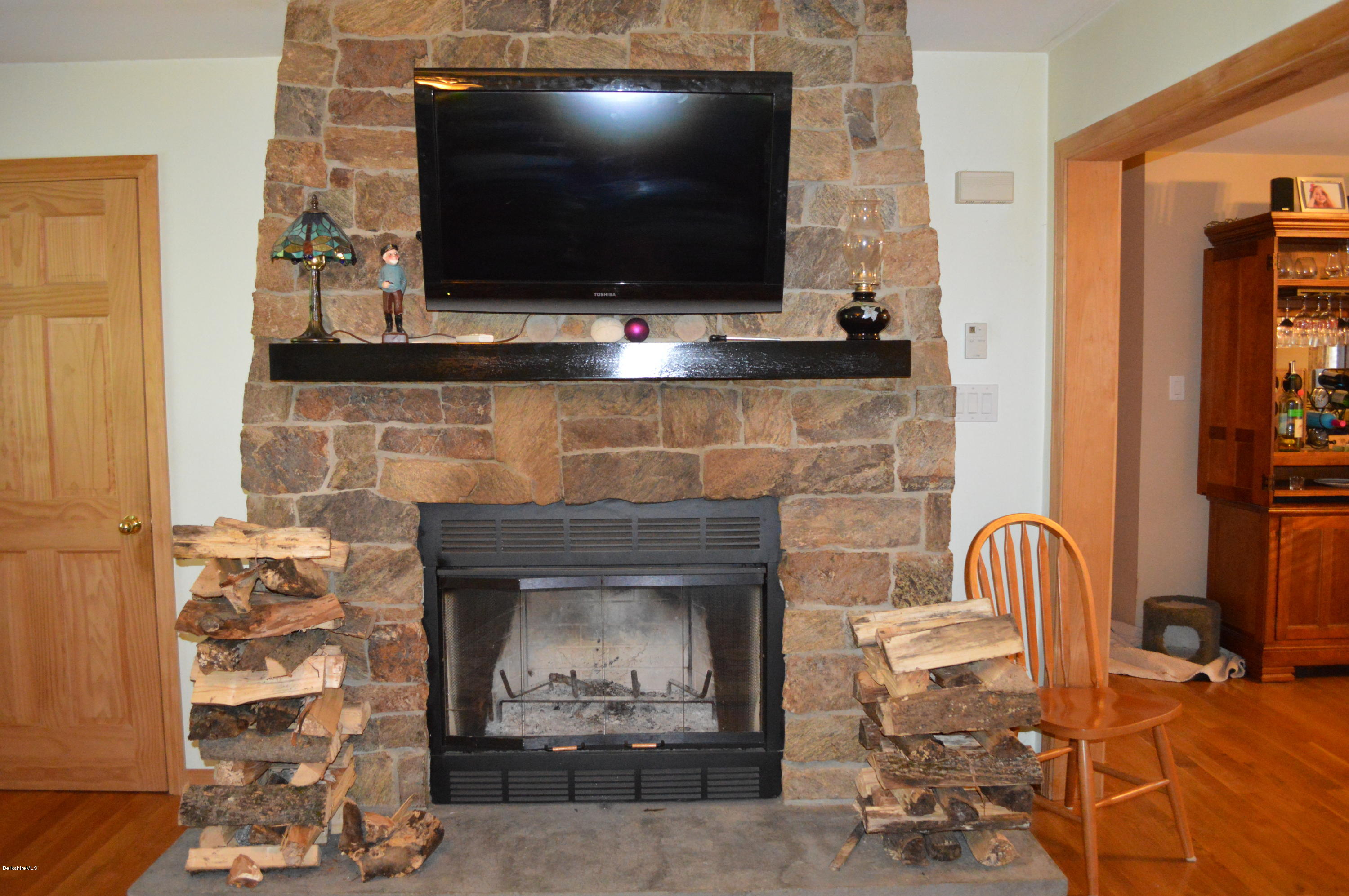753 Upper Valley Road Washington, MA 01223 - Photo 26 of 32 a living room with furniture and a fireplace