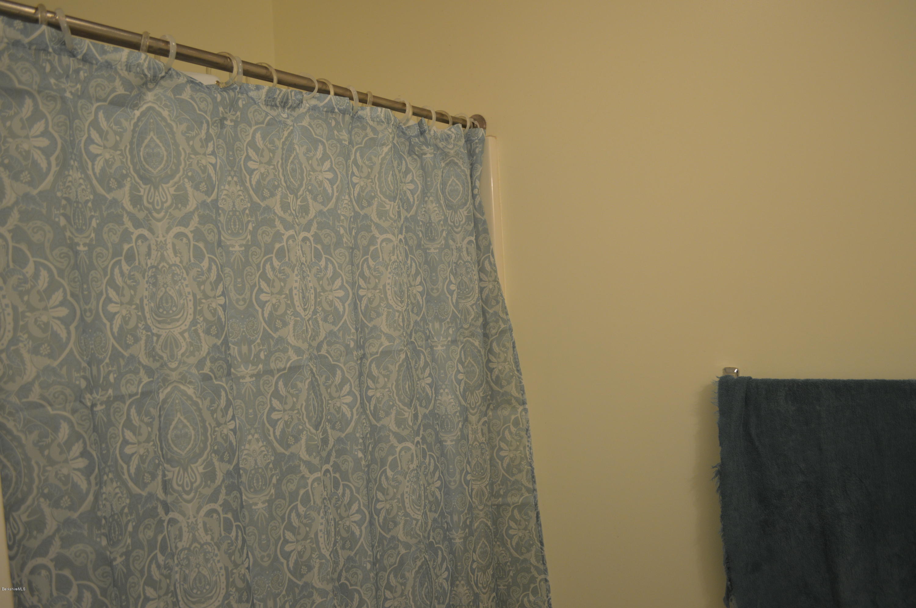 753 Upper Valley Road Washington, MA 01223 - Photo 30 of 32 a bathroom with a shower curtain