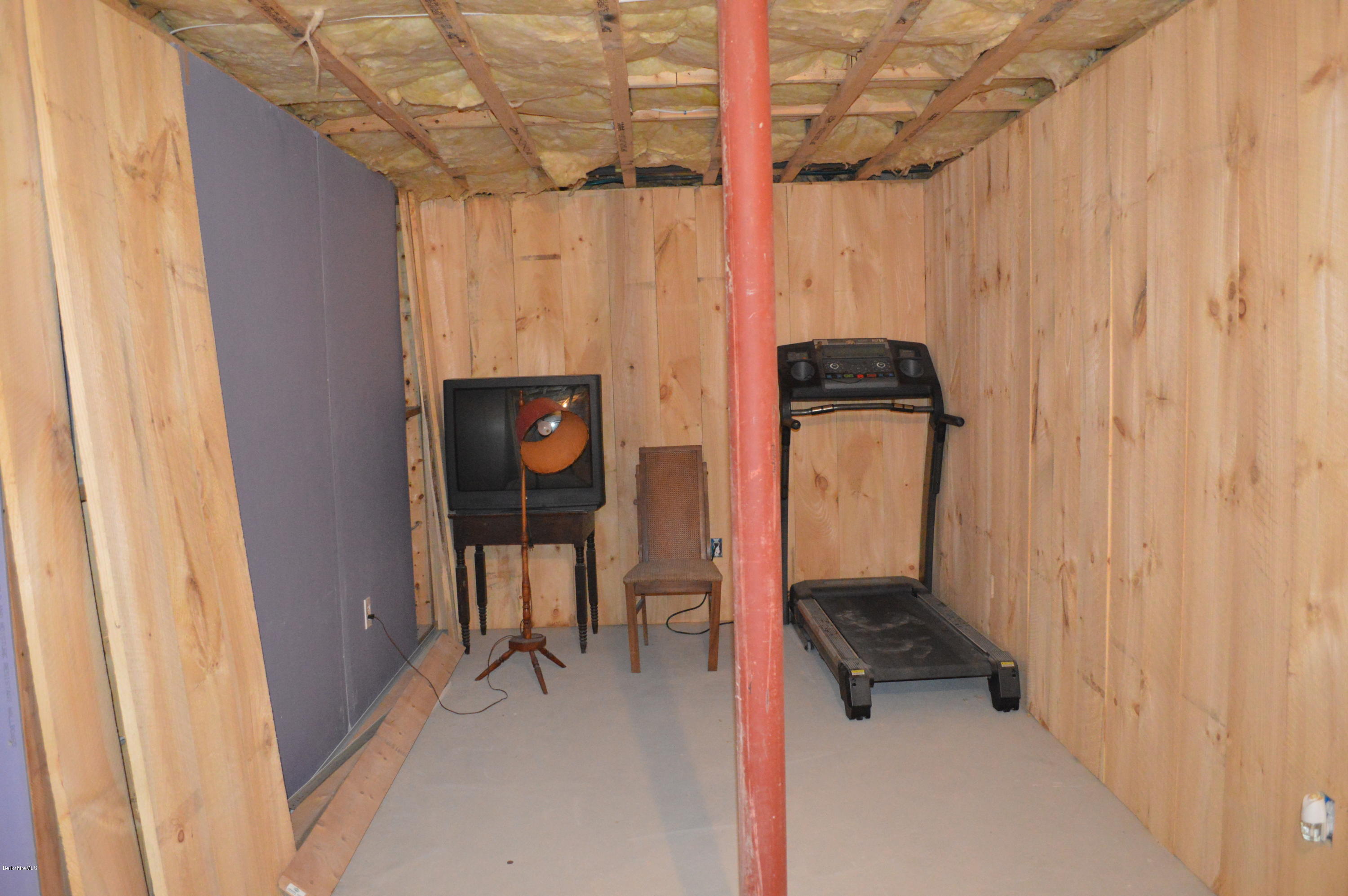 753 Upper Valley Road Washington, MA 01223 - Photo 5 of 32 a hallway with a door and a chair