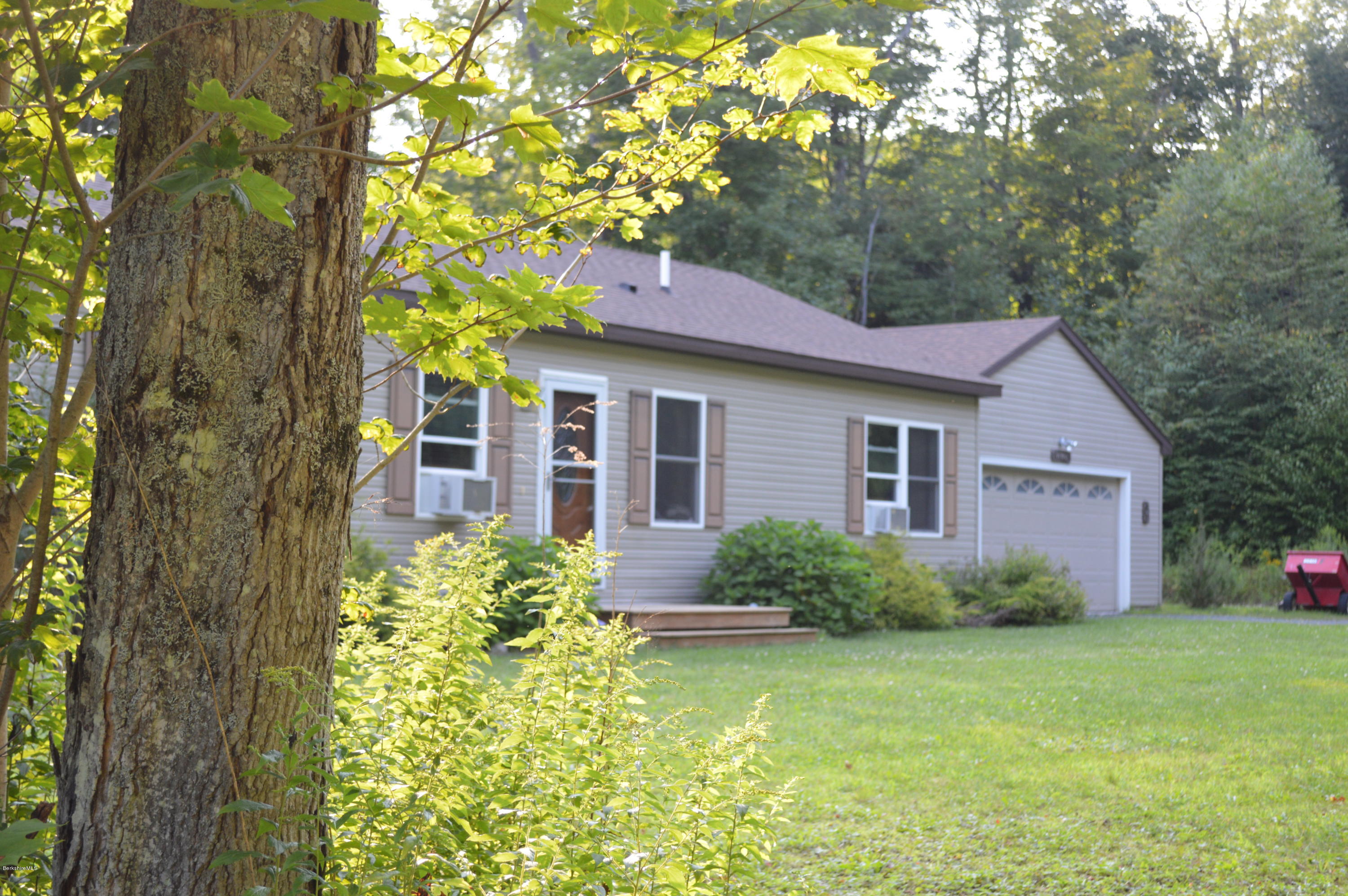 753 Upper Valley Road Washington, MA 01223 - Photo 10 of 32 a front view of a house with garden