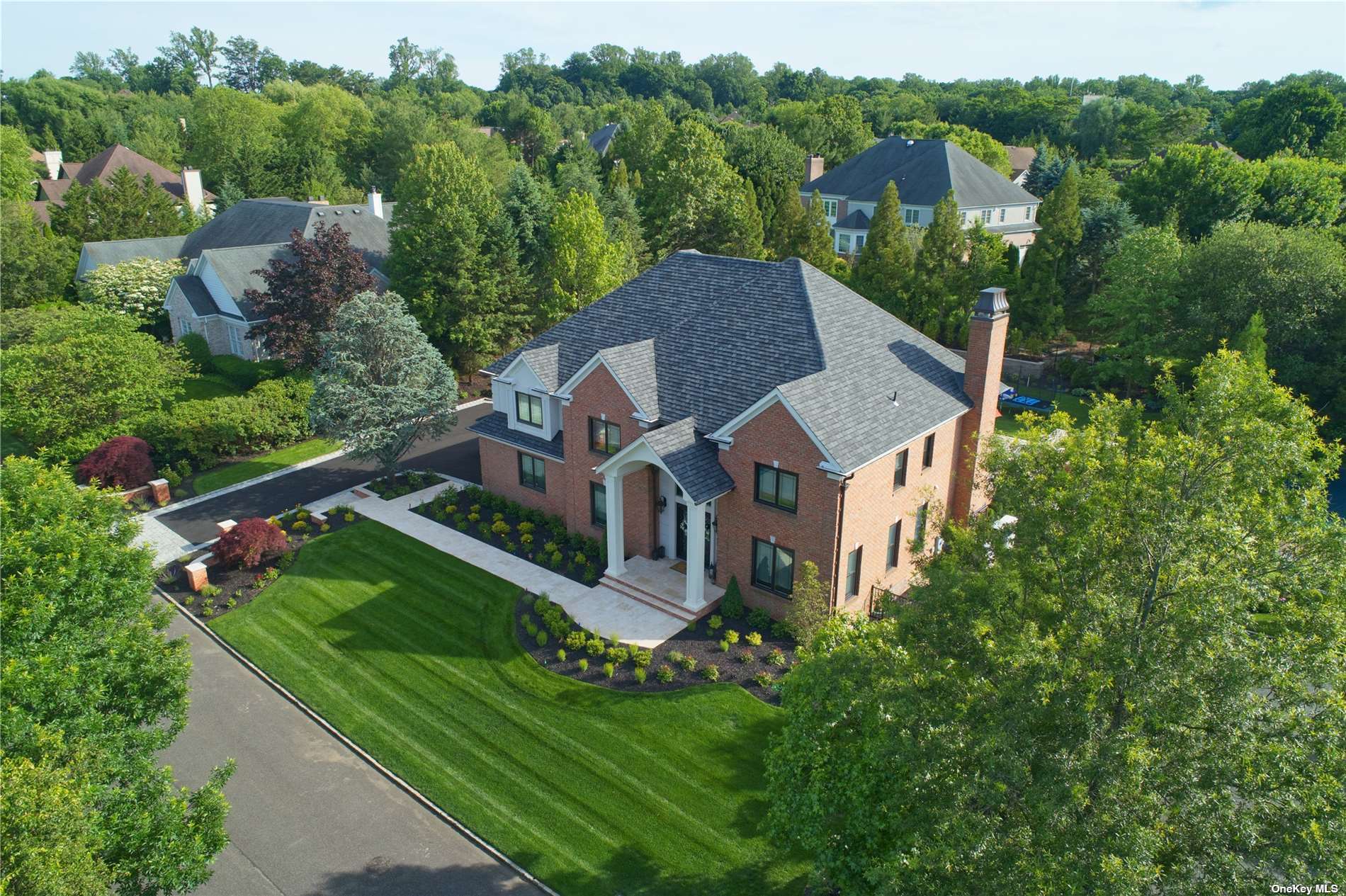 7 Stone Hill Drive Manhasset, NY 11030 - Photo 1 of 1 an aerial view of residential houses with outdoor space and trees