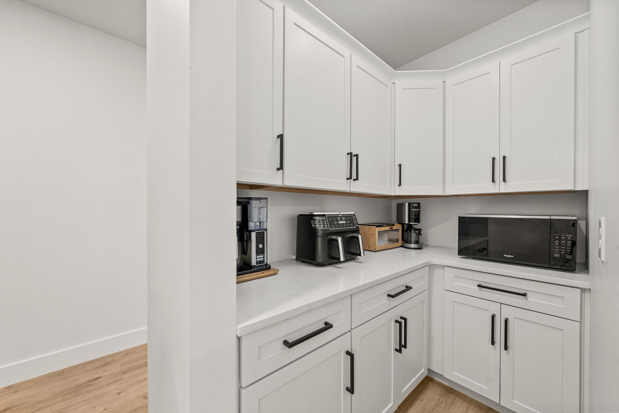 5183 Sango Road Clarksville, TN 37043 - Photo 40 of 84 a kitchen with white cabinets and white appliances