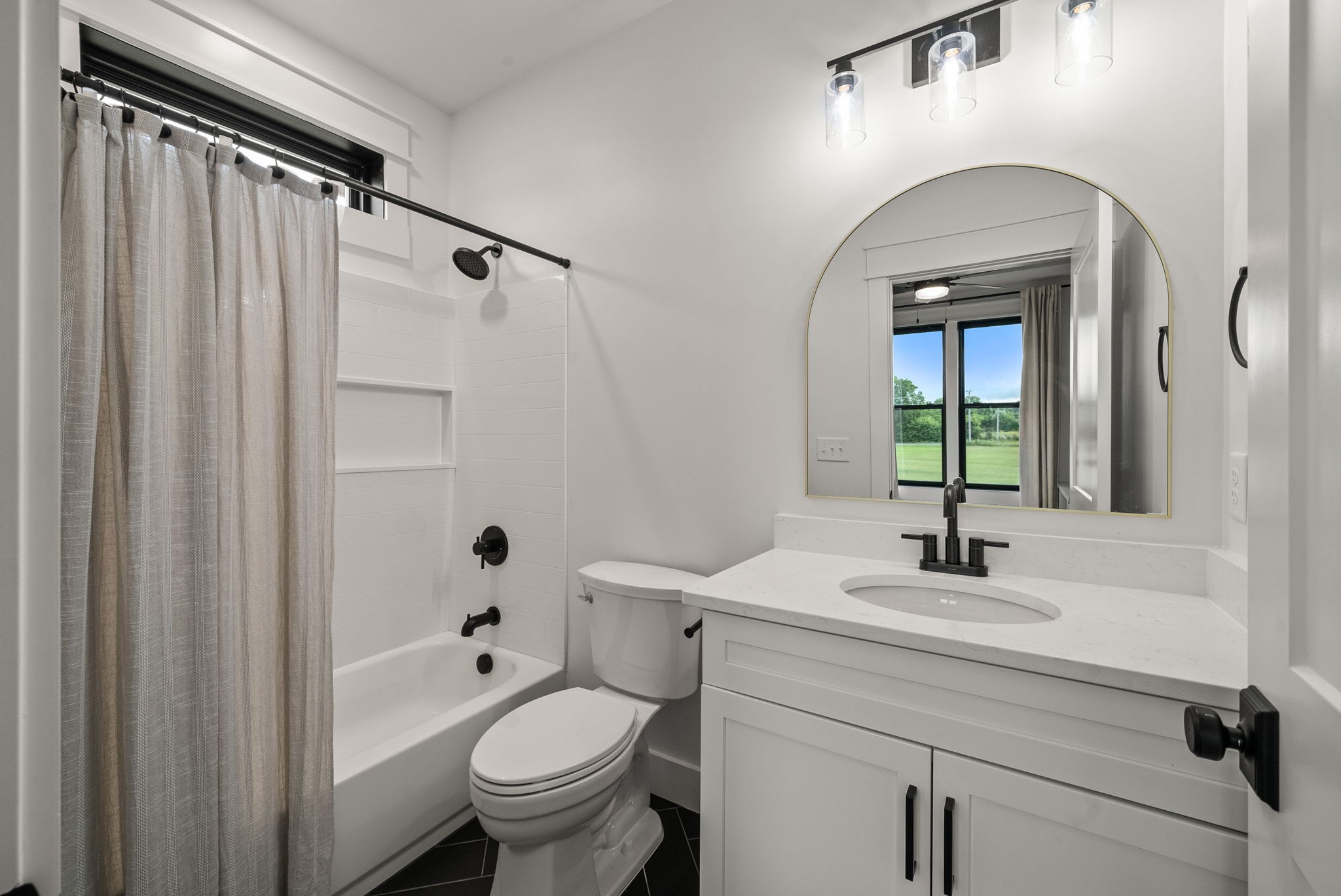 5183 Sango Road Clarksville, TN 37043 - Photo 55 of 84 a bathroom with a sink a toilet and a mirror