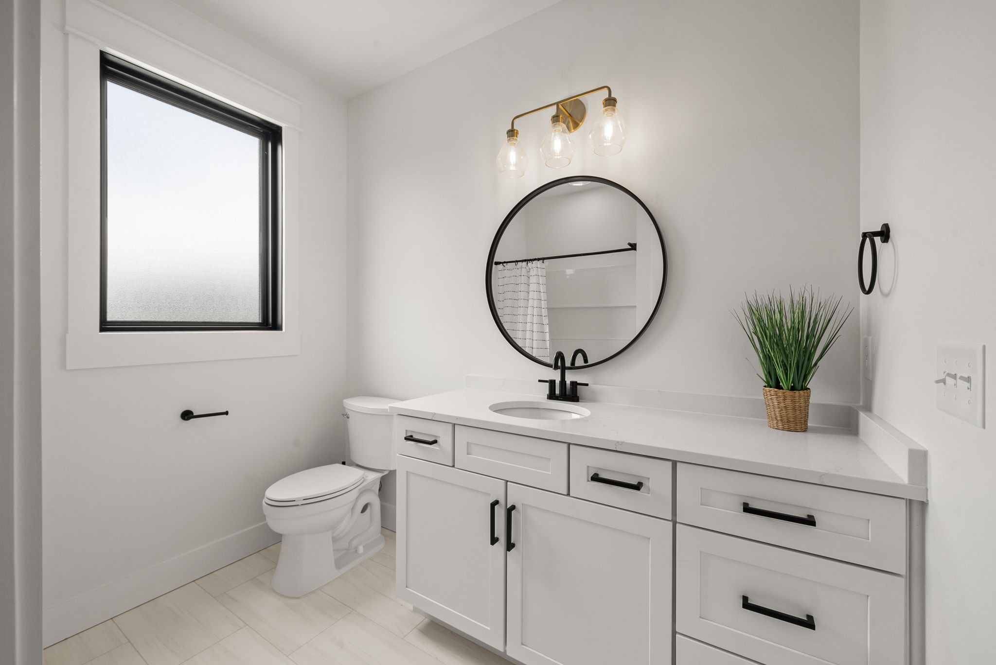 5183 Sango Road Clarksville, TN 37043 - Photo 66 of 84 a bathroom with a toilet a sink and mirror