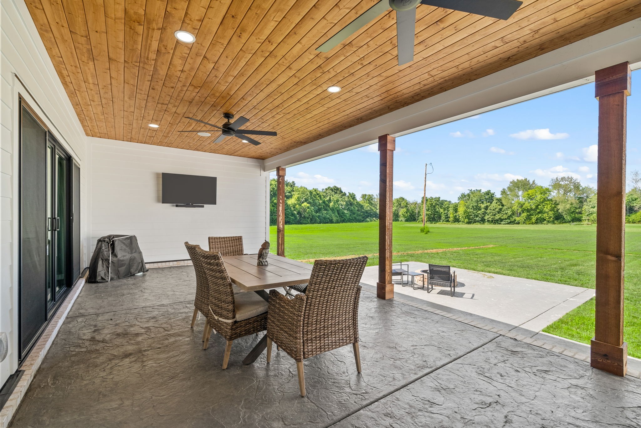 5183 Sango Road Clarksville, TN 37043 - Photo 69 of 84 a view of a patio with a table chairs and a backyard