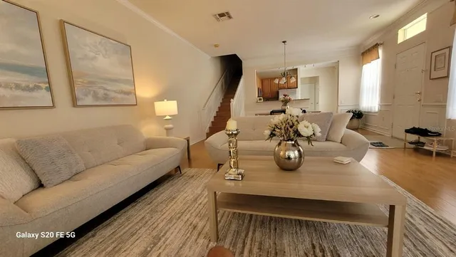 a view of a livingroom with furniture and window