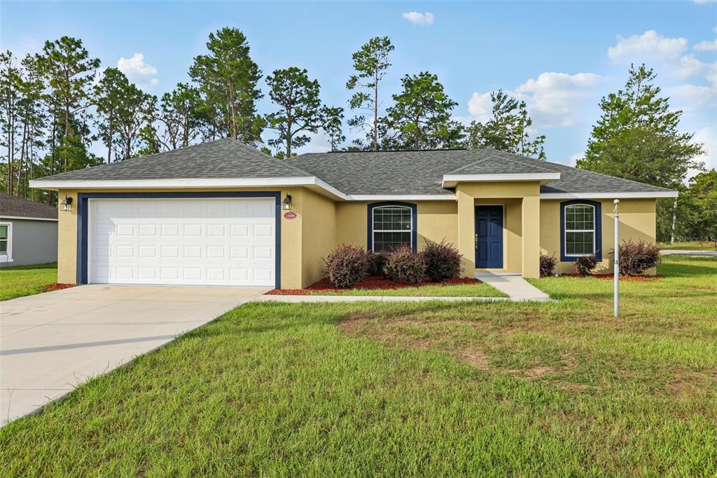 front view of a house with a yard